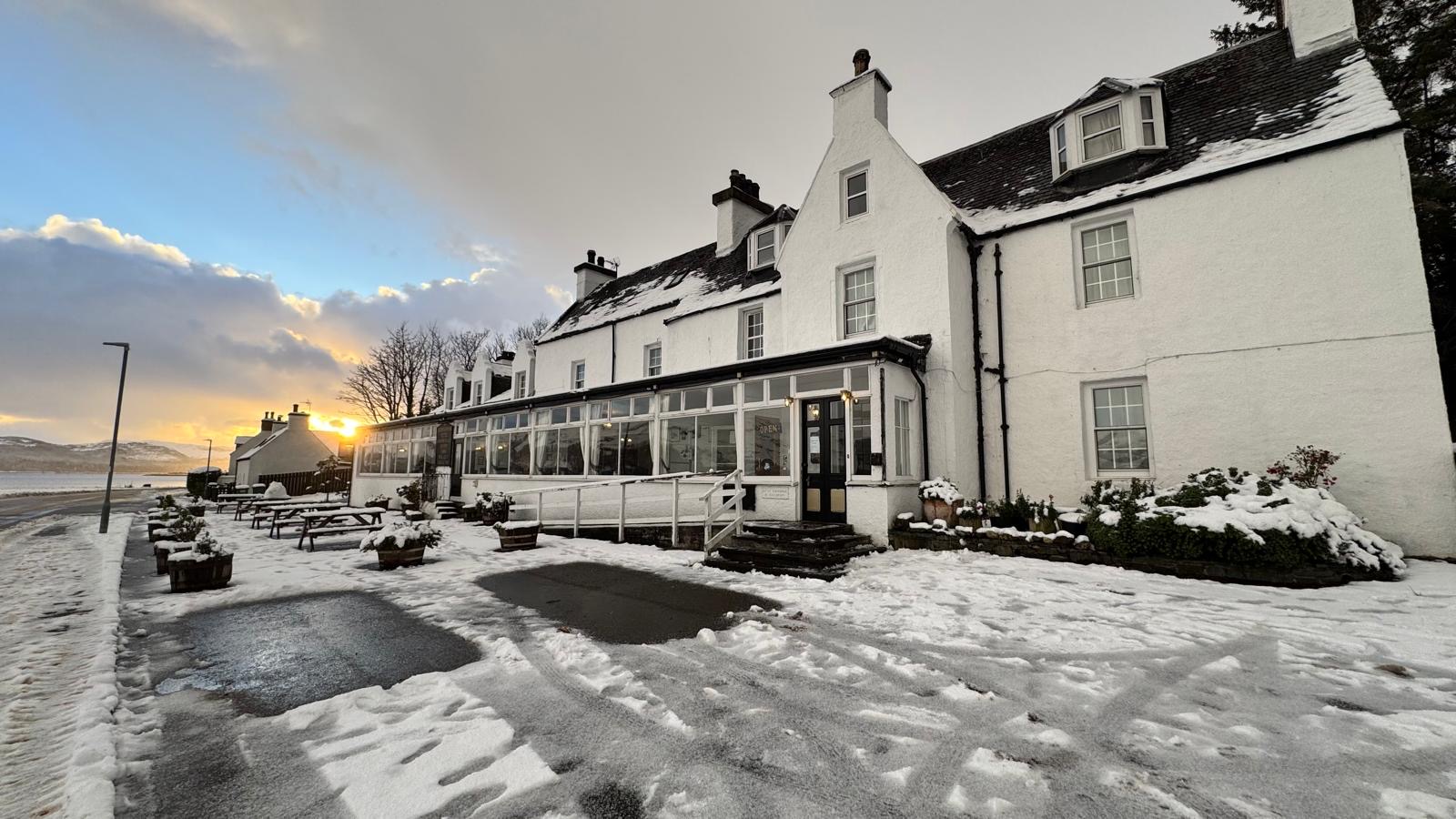 Lochcarron Hotel beside the loch on a snowy winter evening